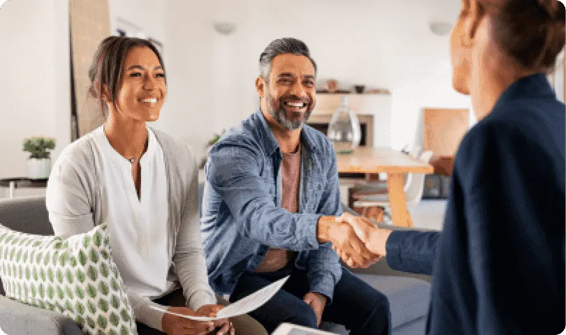 Advisors shaking hands with a client